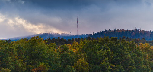 Hill Klet in Blansky les with autumn forest hill and sunset sky. Czech landscape