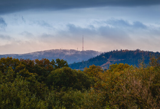 Hill Klet in Blansky les with autumn forest hill and sunset sky. Czech landscape
