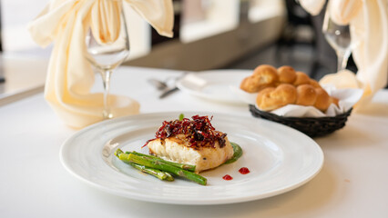 Beautiful served fish on plate. With natural vegetables, green beans. Shabbat food.