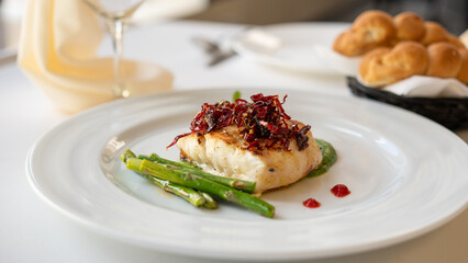 Beautiful served fish on plate. With natural vegetables, green beans. Shabbat food.