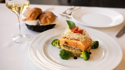 Beautiful served fish on a plate. With natural vegetables, and broccoli. Shabbat food.
