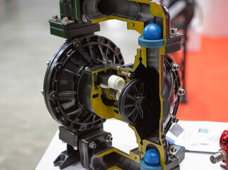 Cross section of industrial plastic diaphragm pump for gas and liquid.
