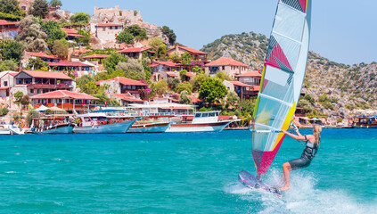 Beautiful blue sky with Windsurfer Surfing Wind On Waves - Kekova island (Ucagiz - Kale) - Antalya,...