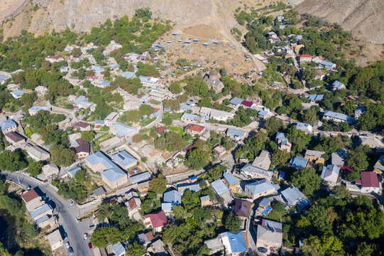 Aerial view of Bjni village and Surp Astvatsatsin Church (build in 1031) on sunny summer day. Kotayk Province, Armenia.