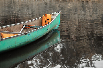 Teal Canoe on the Lake