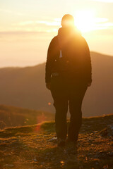 Woman unrecognizable against the sun