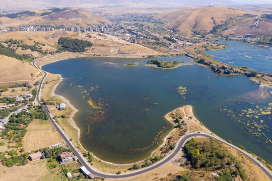 Aerial view of Hrazdan reservoir and Hrazdan town on sunny summer day. Kotayk Province, Armenia.