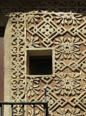Detail of traditional facade with sgraffito geometric decoration in the historic city center of Segovia. Spain.