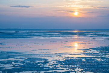 Naklejka na ściany i meble sunset over the frozen seaKalajoki, Finland