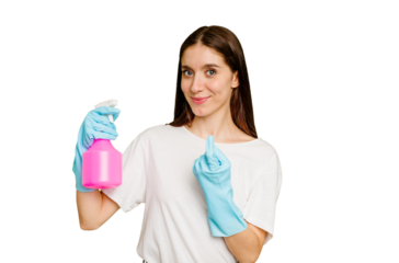 Young cleaner woman isolated pointing with finger at you as if inviting come closer.