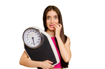Young caucasian woman holding a scale isolated biting fingernails, nervous and very anxious.