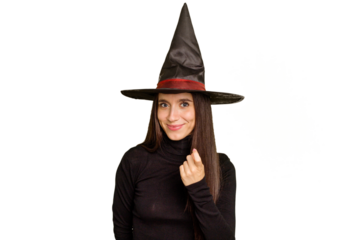 Young caucasian woman dressed as a witch for halloween day isolated pointing with finger at you as if inviting come closer.