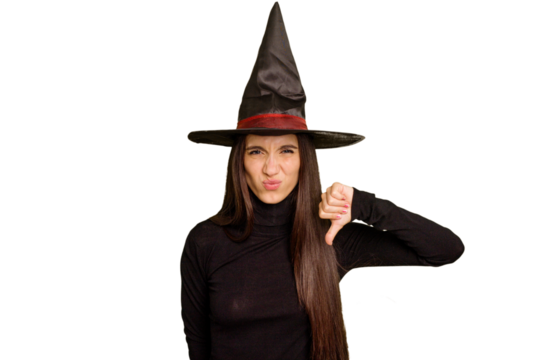 Young caucasian woman dressed as a witch for halloween day isolated showing a dislike gesture, thumbs down. Disagreement concept.