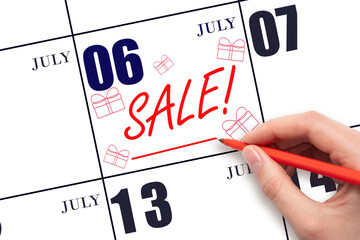Hand writing text SALE and drawing gift boxes on calendar date July 6. Shopping Reminder
