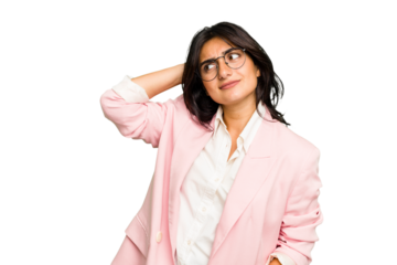 Young Indian business woman wearing a pink suit isolated touching back of head, thinking and making a choice.