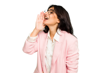 Young Indian business woman wearing a pink suit isolated shouting and holding palm near opened mouth.