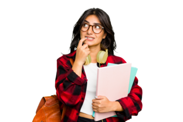 Young student Indian woman wearing headphones isolated relaxed thinking about something looking at a copy space.