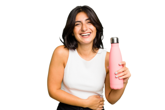 Young Indian woman holding a thermo isolated laughing and having fun.