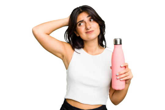 Young Indian woman holding a thermo isolated touching back of head, thinking and making a choice.