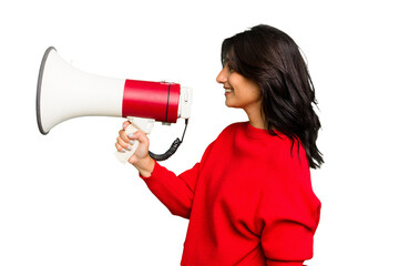 Young Indian woman holding a megaphone isolated