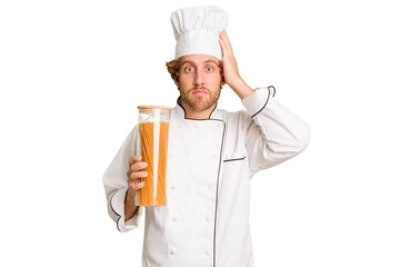 Young cook man isolated on white background being shocked, she has remembered important meeting.