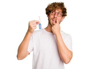 Young caucasian man holding home keys isolated on white background relaxed thinking about something looking at a copy space.