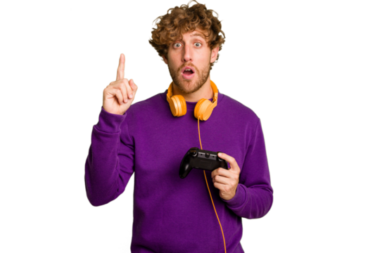 Young caucasian gamer man holding a game controller isolated on white background having an idea, inspiration concept.