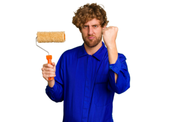 Young painter man holding a roll isolated on white background showing fist to camera, aggressive facial expression.
