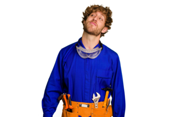 Young caucasian electrician man isolated on white background dreaming of achieving goals and purposes