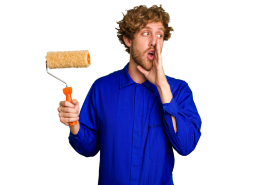 Young painter man holding a roll isolated on white background is saying a secret hot braking news and looking aside