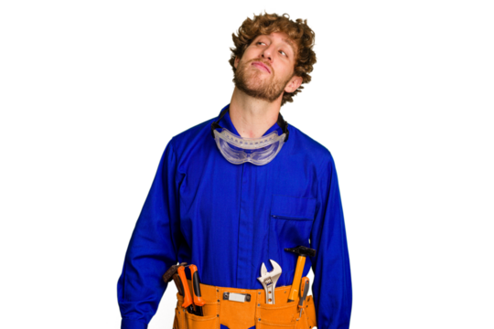 Young caucasian electrician man isolated on white background dreaming of achieving goals and purposes