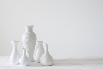 Fototapeta na wymiar ceramic white vases on white background