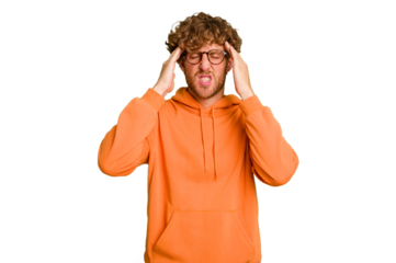 Young caucasian man isolated on green chroma background touching temples and having headache.