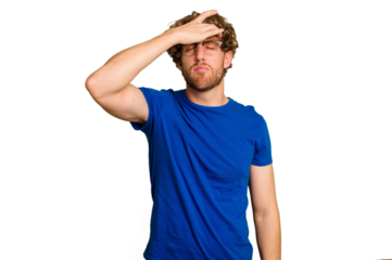 Young caucasian man isolated on green chroma background touching temples and having headache.