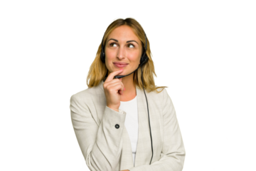 Telemarketer caucasian woman working with a headset isolated on green chroma background looking sideways with doubtful and skeptical expression.