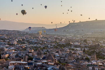 Hot air balloons above Goreme town in Cappadocia, Turkey