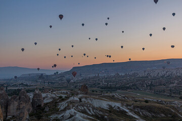Hot air balloons above Cappadocia landscape, Turkey
