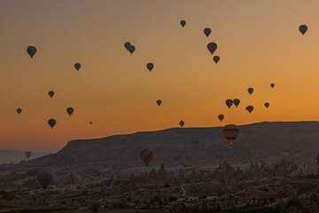 Hot air balloons above Cappadocia landscape, Turkey