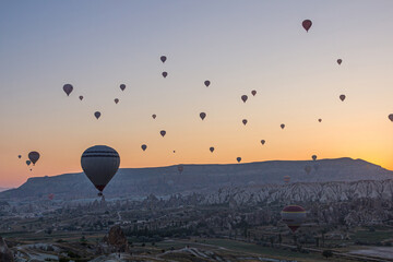 Hot air balloons above Cappadocia landscape, Turkey