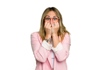 Young caucasian woman isolated on green chroma background biting fingernails, nervous and very anxious.