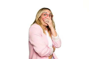 Young caucasian woman isolated on green chroma background scared and afraid.