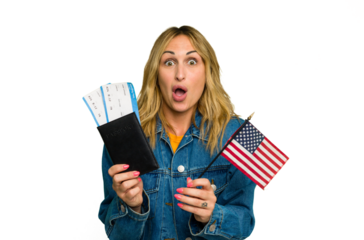 Young caucasian woman holding a passport and USA flag isolated on green chroma background