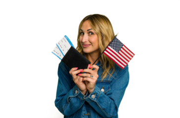 Young caucasian woman holding a passport and USA flag isolated on green chroma background