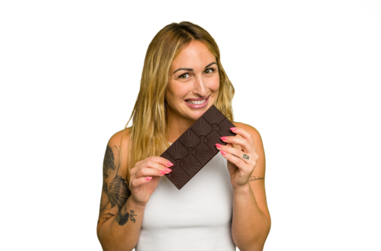 Young caucasian woman holding chocolate isolated on green chroma background