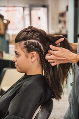 Beautiful  Woman Getting Haircut By Hairdresser In The Beauty Salon.  Hair style concept