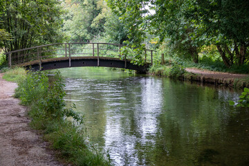 rustic old footbridge over the River Test Hampshire England