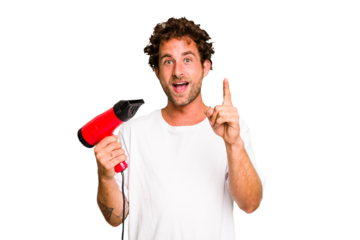 Young caucasian man holding an hairdryer isolated having an idea, inspiration concept.