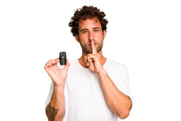 Young caucasian man holding car keys isolated keeping a secret or asking for silence.