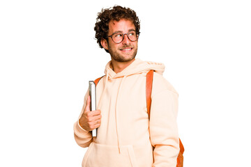 Young caucasian student man isolated looks aside smiling, cheerful and pleasant.