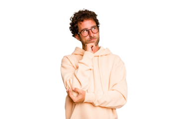 Young caucasian curly hair man isolated Young caucasian man with curly hair isolated thinking and looking up, being reflective, contemplating, having a fantasy.